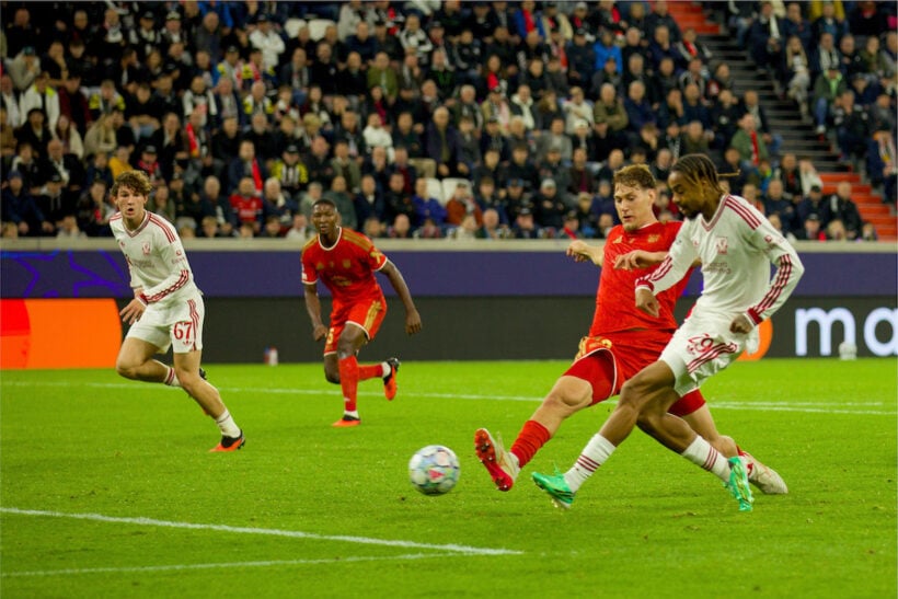 Bradley Barcola shoots in Liverpool's white away kit against LASK